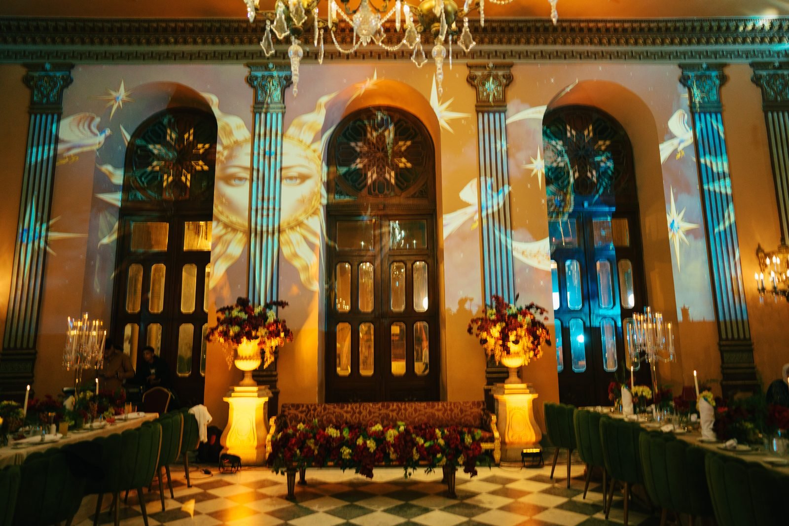 Candlelit reception hall with illuminated arches