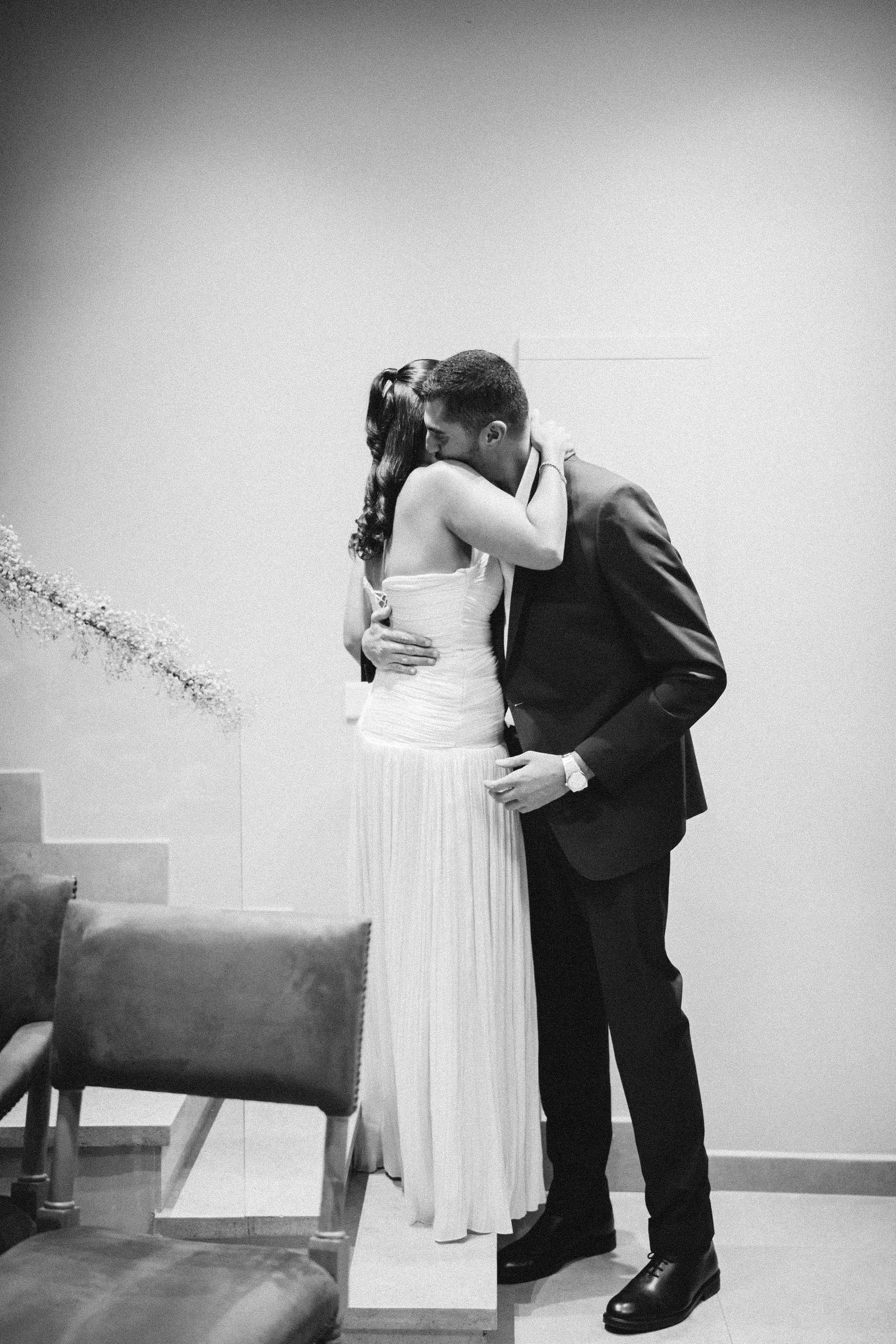 Couple embracing, black and white