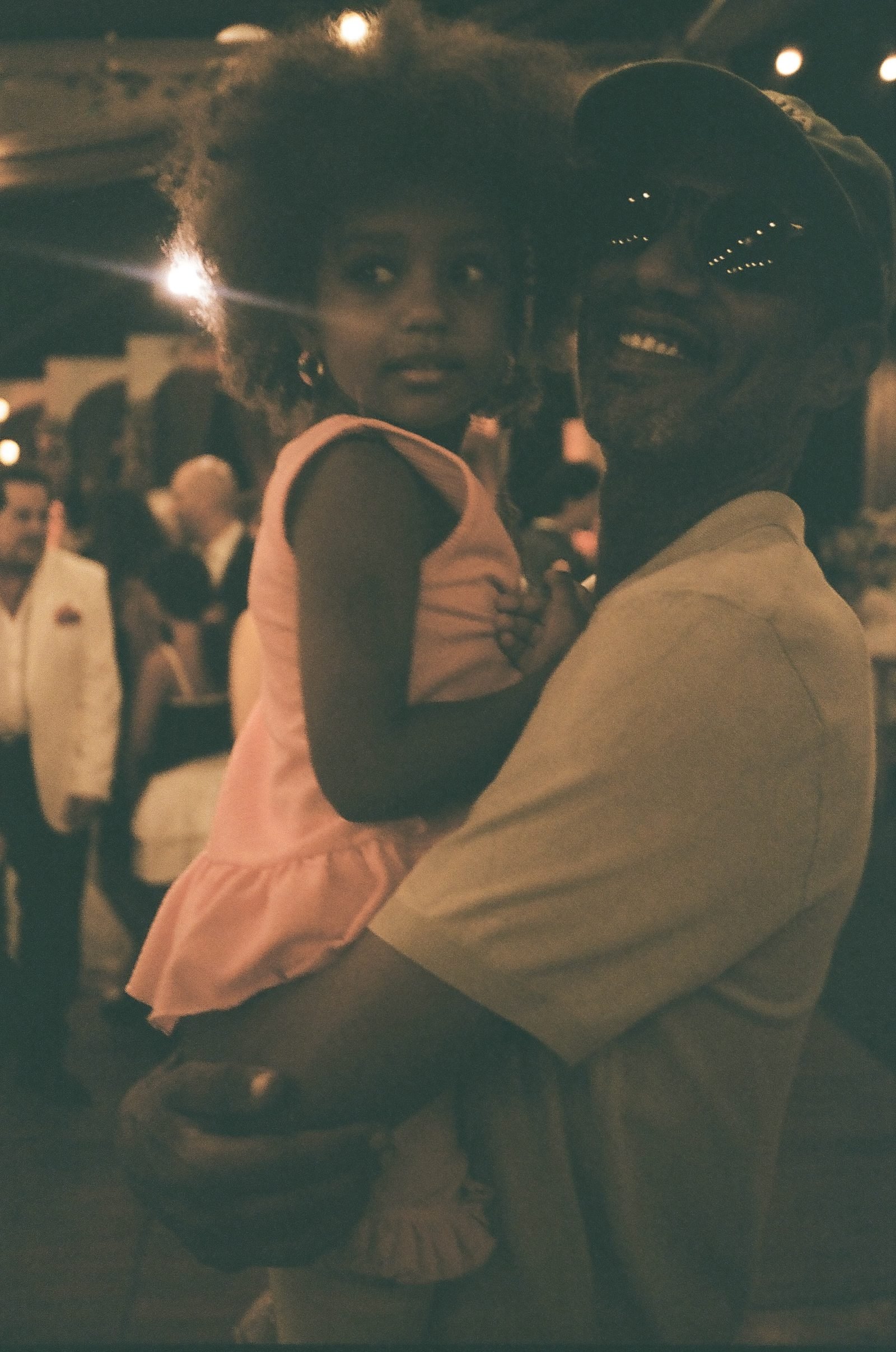 Guest holding a child at the party
