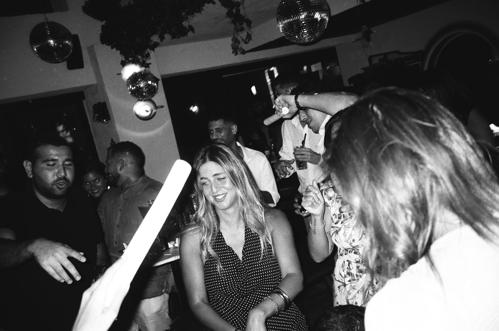 Guests dancing at the party, black and white