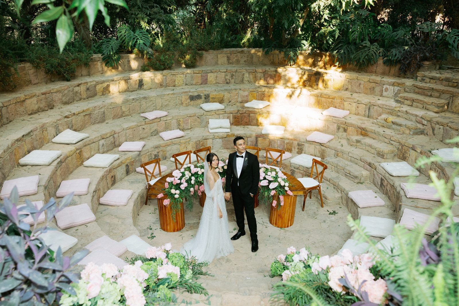 Couple standing in a circular garden amphitheatre